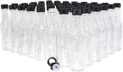 GBO GLASSBOTTLEOUTLET.COM (Pack of 48) 5 oz. Clear Glass Hot Sauce Bottle (woozy) with Black Cap and Orifice Reducer 
